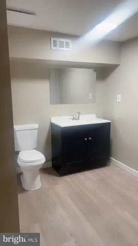 a view of room with window and hardwood floor