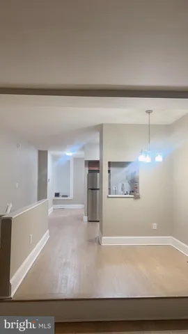a view of a kitchen with a sink and a window