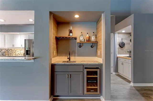 a view of a livingroom with an empty space and a flat screen tv