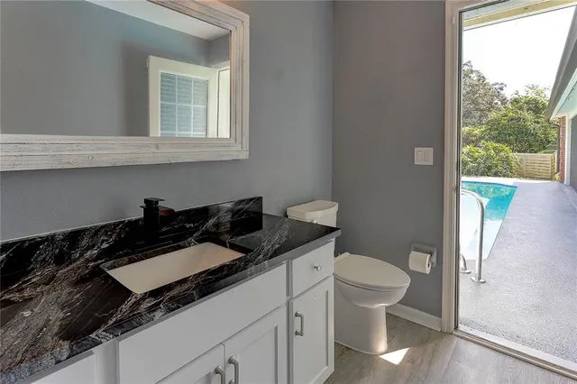 an aerial view of a house with outdoor space pool seating area and yard