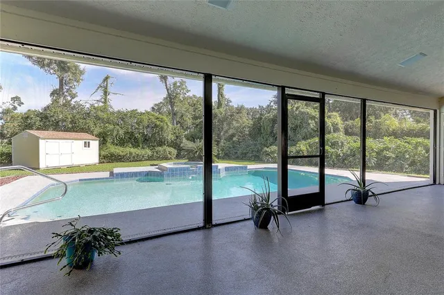 a view of a floor to ceiling window and an empty room