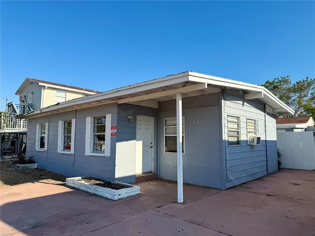 a front view of a house with a garage