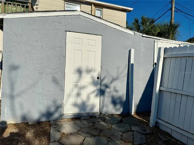 a view of a lake with a table and chairs