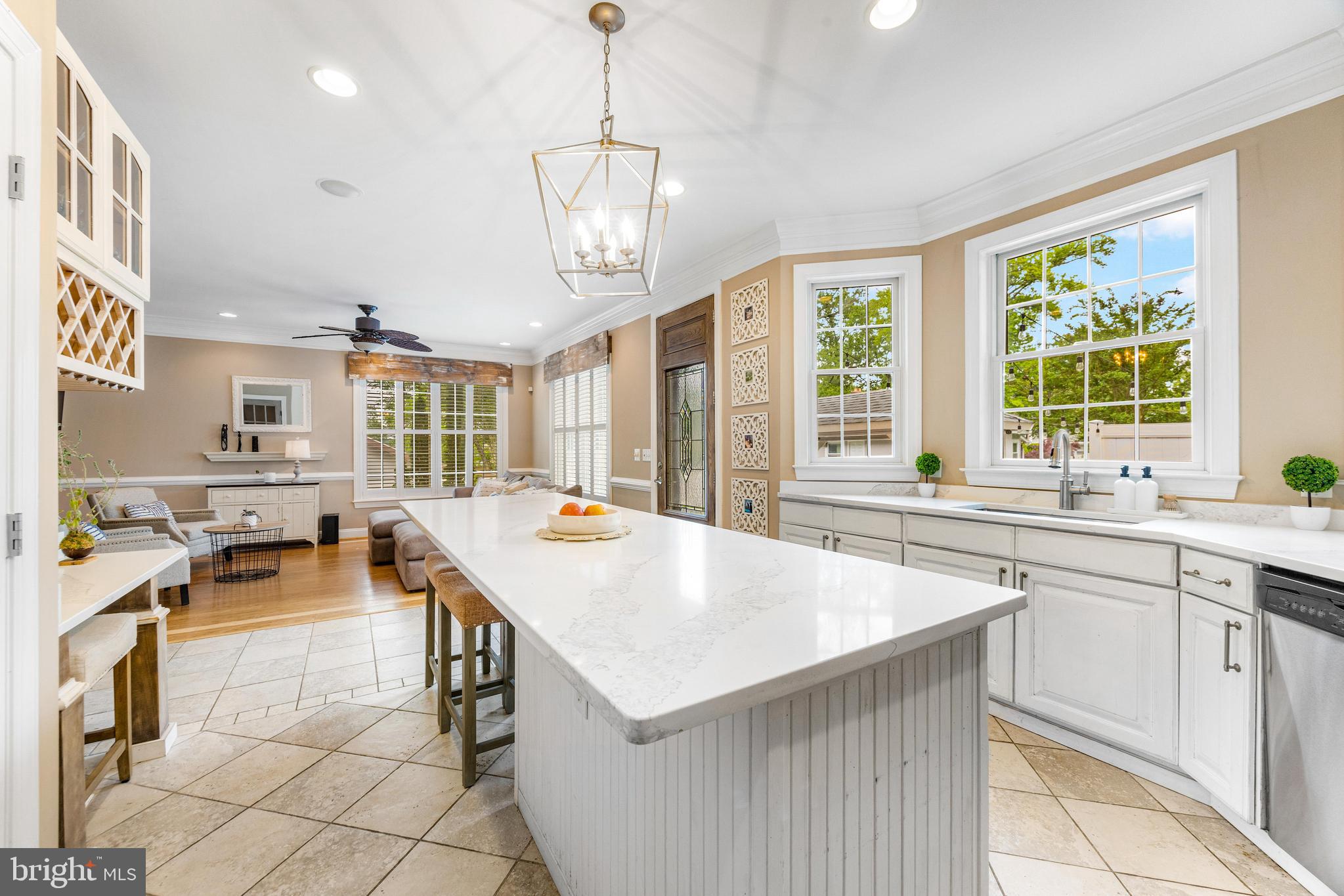 10 Dogwood Road Riva, MD 21140 - Photo 15 of 58 a open kitchen with stainless steel appliances granite countertop a sink dishwasher a stove and a dining table with wooden floor