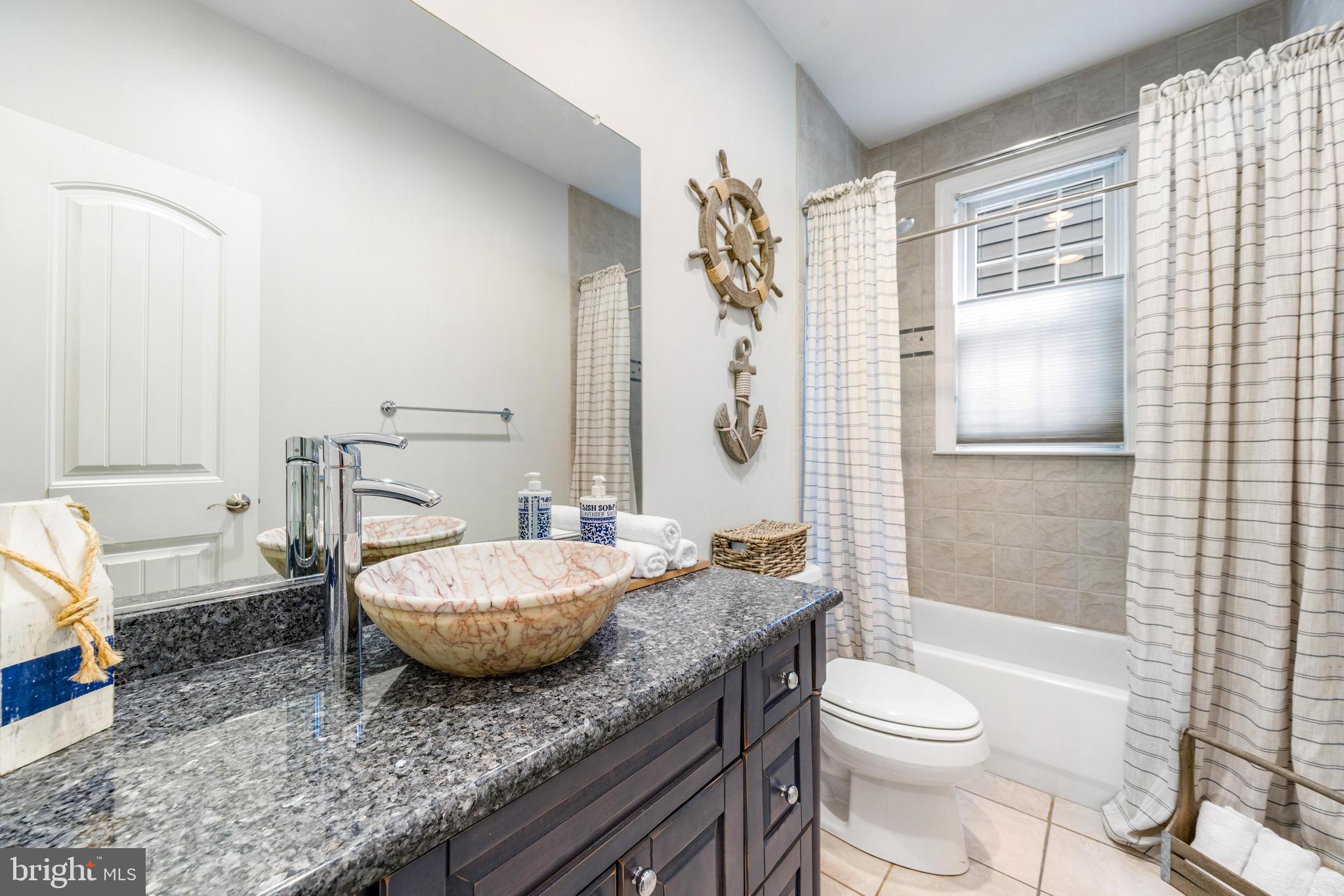 10 Dogwood Road Riva, MD 21140 - Photo 20 of 58 a spacious bathroom with a granite countertop toilet sink and shower