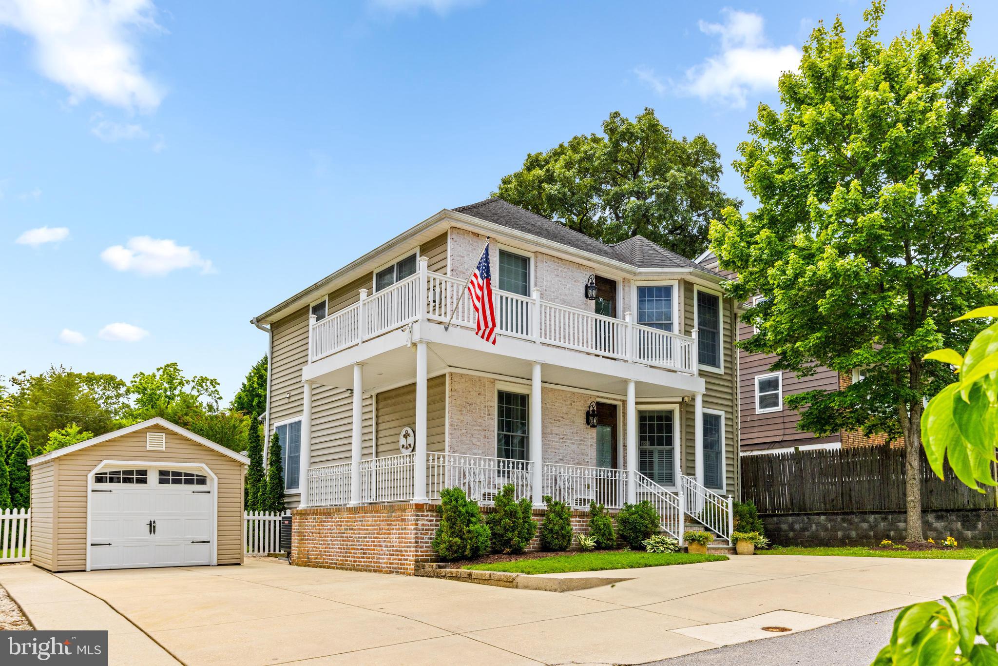 10 Dogwood Road Riva, MD 21140 - Photo 2 of 58 a front view of a house with a yard and garage