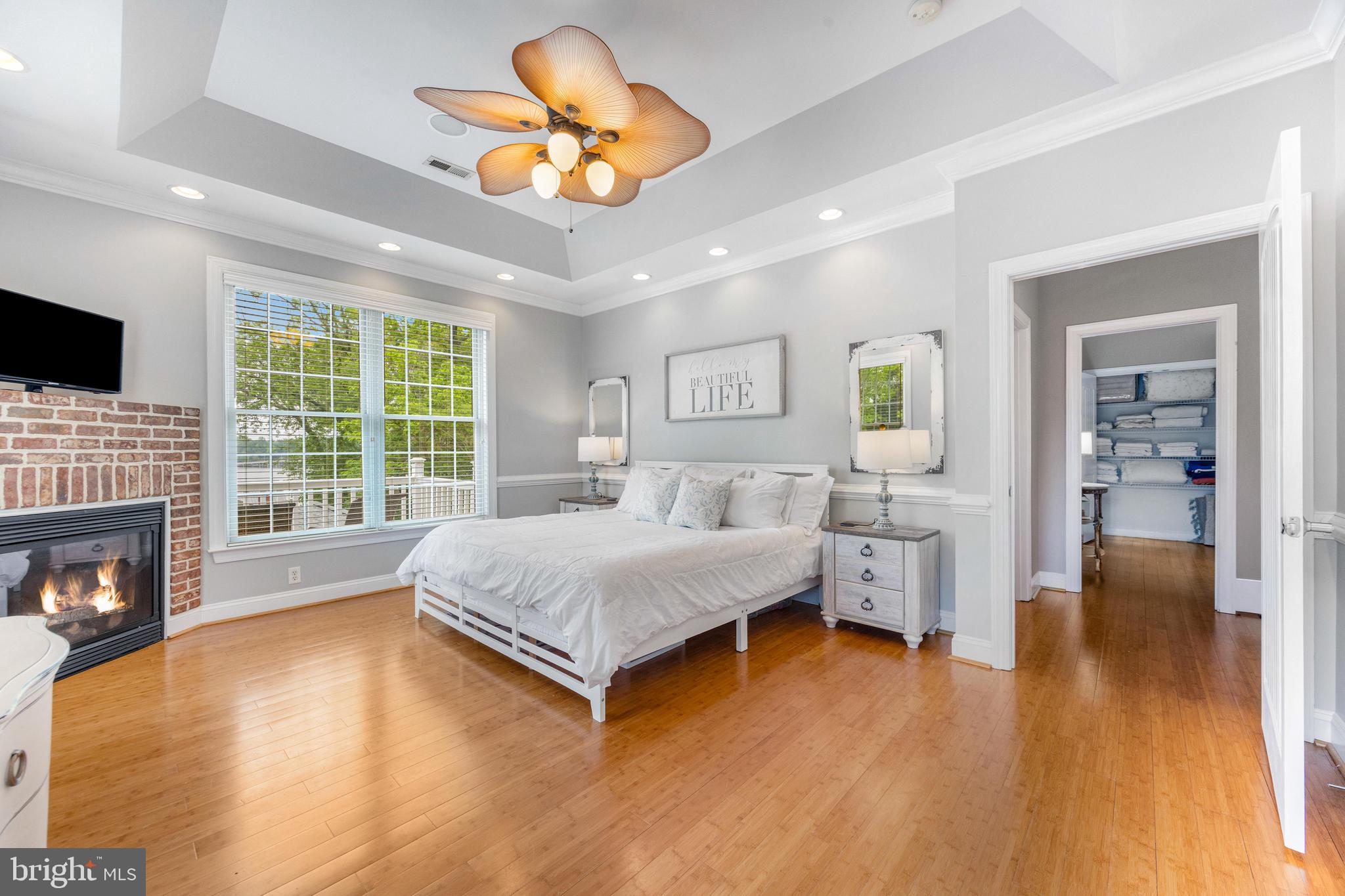 10 Dogwood Road Riva, MD 21140 - Photo 23 of 58 a spacious bedroom with a bed and a chandelier