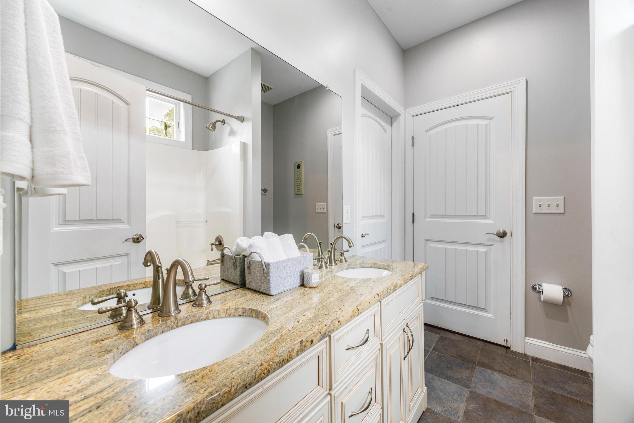 10 Dogwood Road Riva, MD 21140 - Photo 35 of 58 a bathroom with a granite countertop sink and a mirror