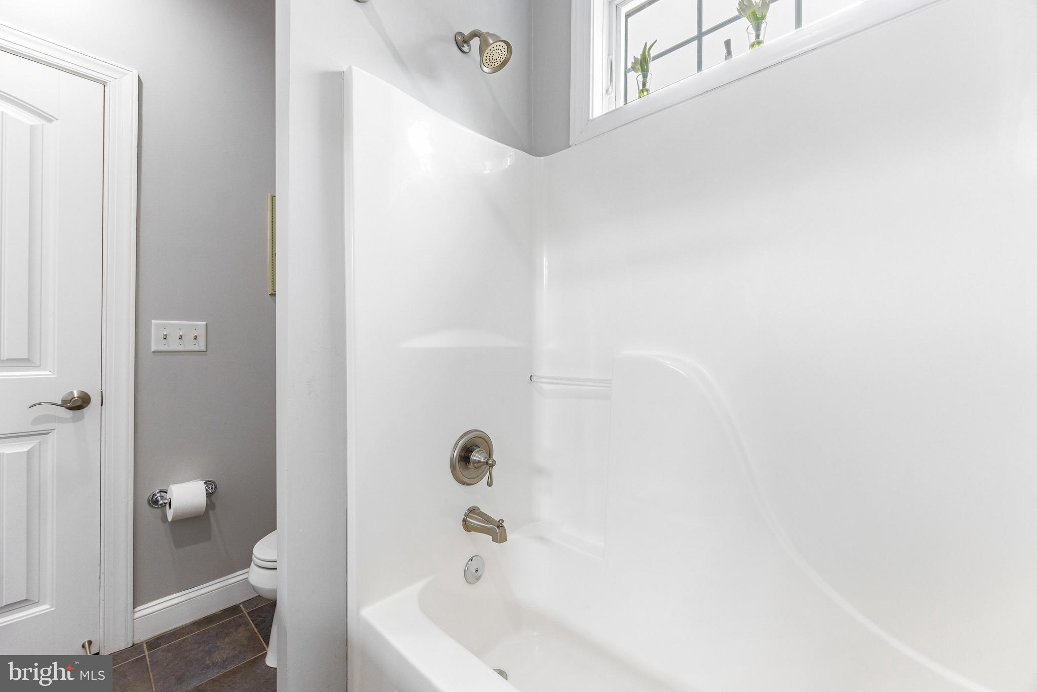 10 Dogwood Road Riva, MD 21140 - Photo 36 of 58 a bathroom with a bathtub and a shower