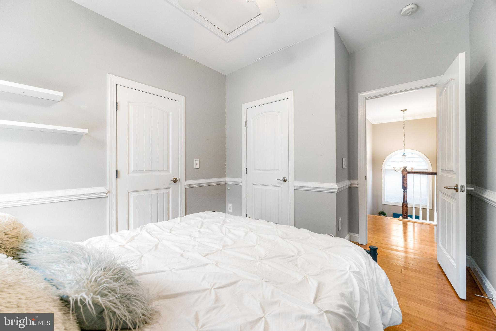 10 Dogwood Road Riva, MD 21140 - Photo 38 of 58 a bedroom with a bed and wooden floor