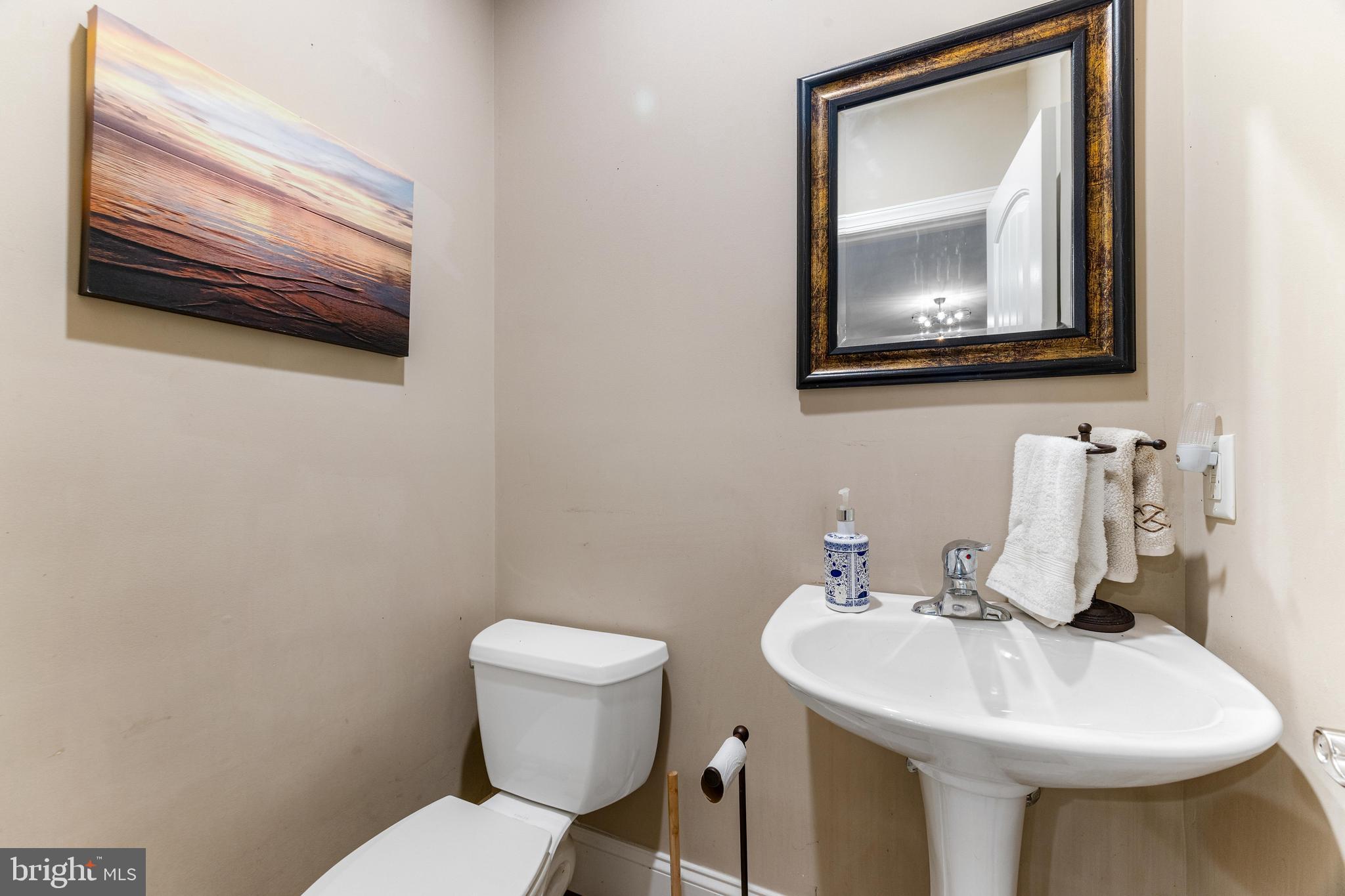 10 Dogwood Road Riva, MD 21140 - Photo 46 of 58 a bathroom with a toilet sink and mirror
