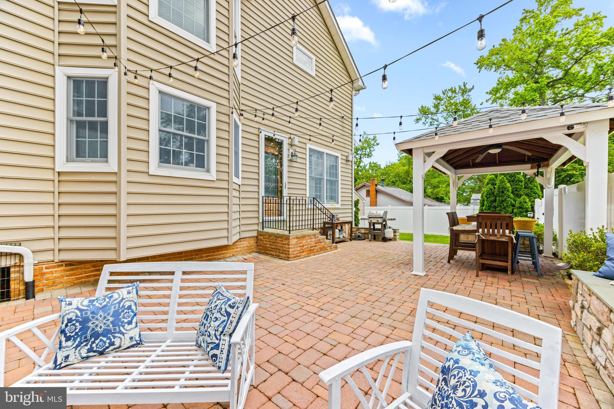 10 Dogwood Road Riva, MD 21140 - Photo 51 of 58 a view of a patio with a table and chairs under an umbrella
