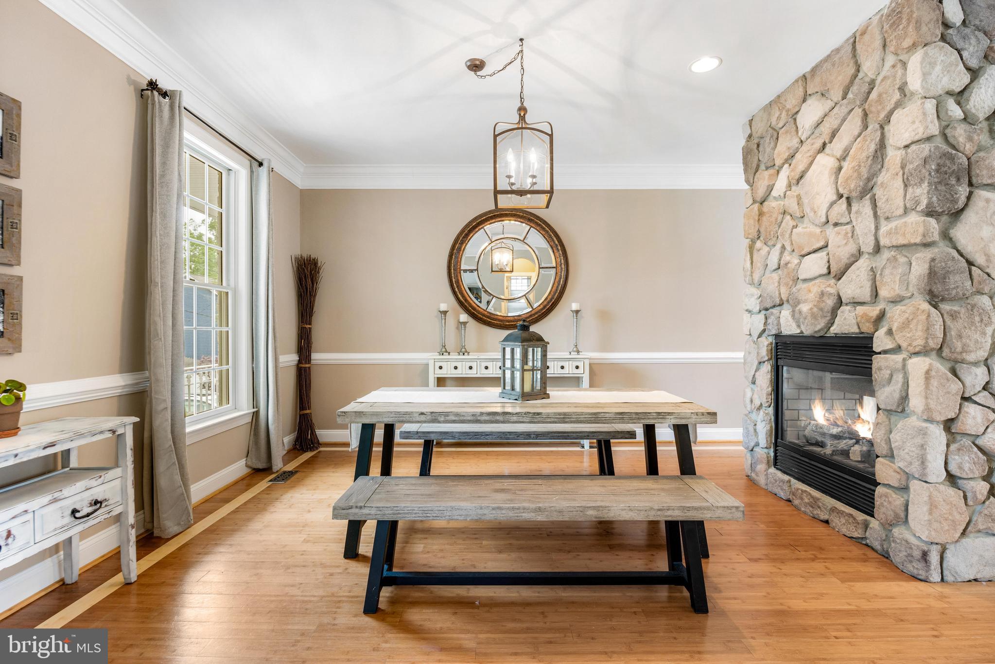 10 Dogwood Road Riva, MD 21140 - Photo 7 of 58 a view of a livingroom with furniture wooden floor a fireplace and a chandelier