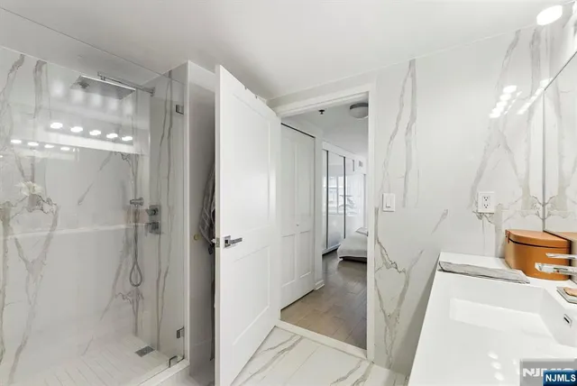 a bathroom with a tub and shower