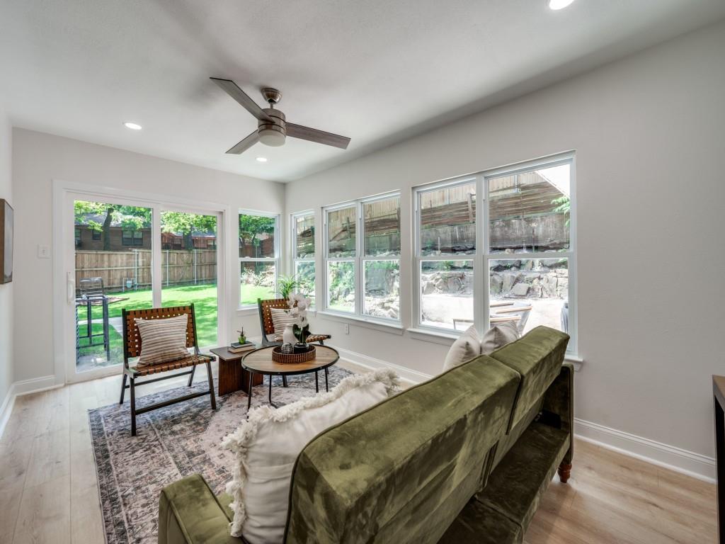 3406 Springwood Lane Dallas, TX 75233 - Photo 19 of 36 a living room with furniture and large windows