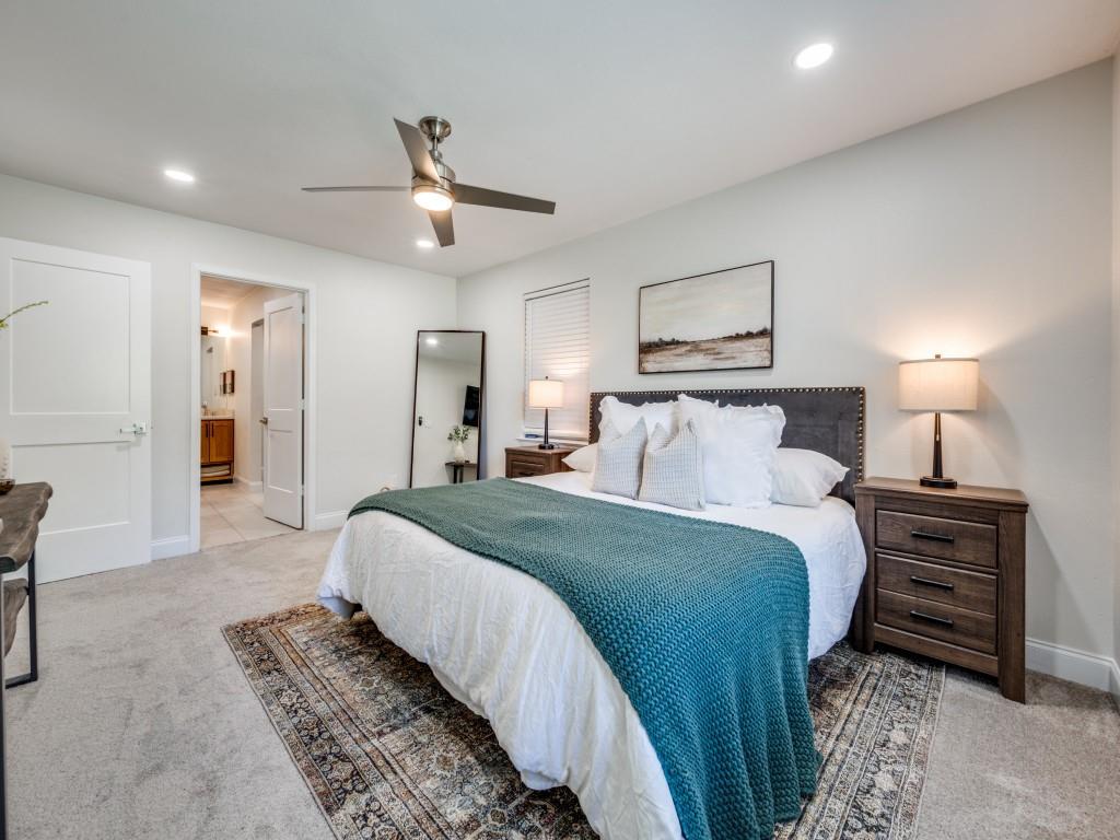 3406 Springwood Lane Dallas, TX 75233 - Photo 25 of 36 a spacious bedroom with a bed and dresser