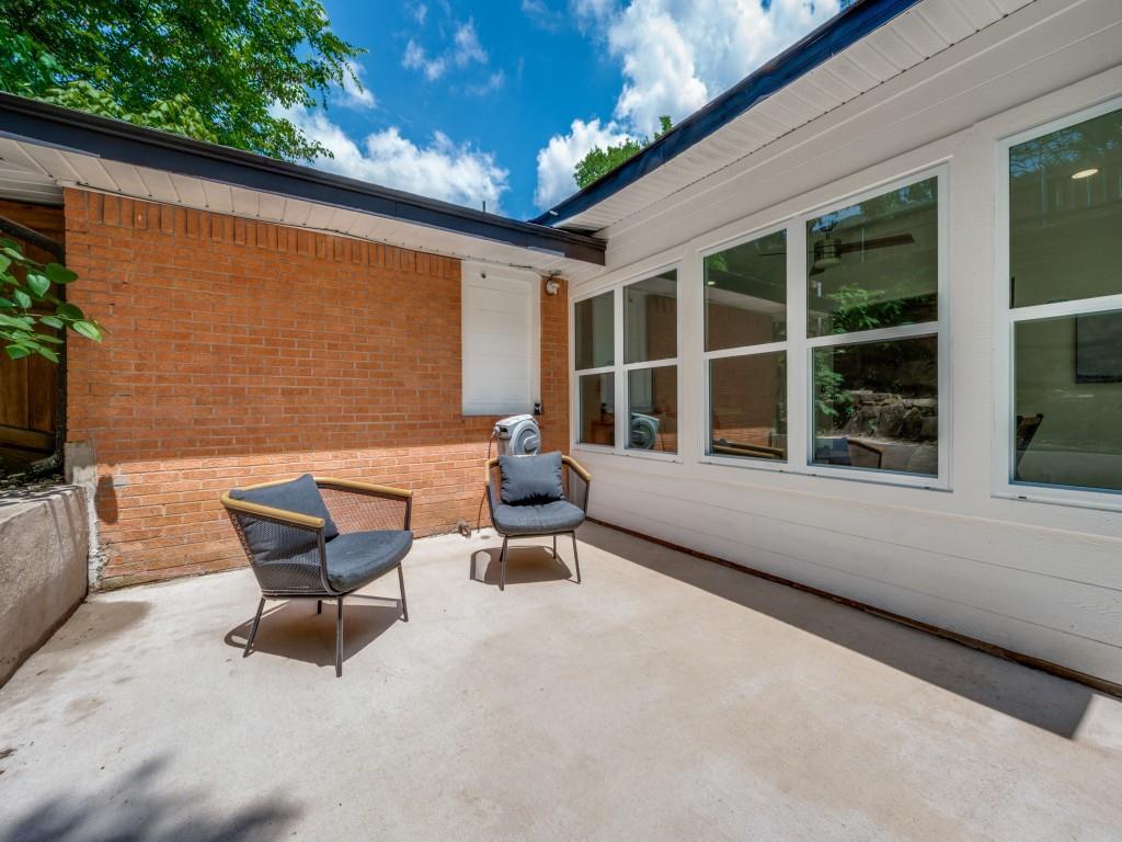 3406 Springwood Lane Dallas, TX 75233 - Photo 33 of 36 a balcony with couple of chairs and a couch