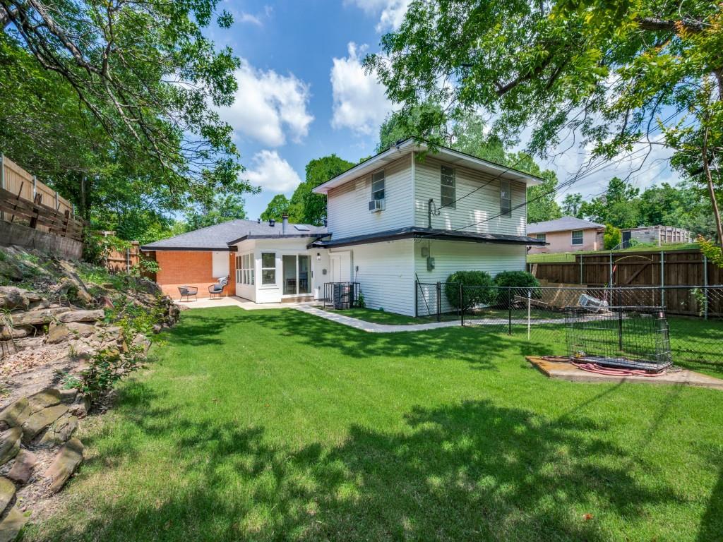 3406 Springwood Lane Dallas, TX 75233 - Photo 35 of 36 a view of a house with a yard and sitting area