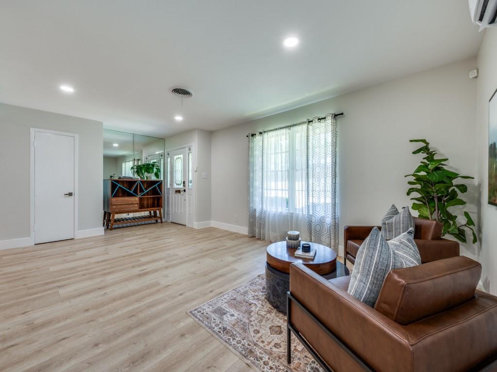 3406 Springwood Lane Dallas, TX 75233 - Photo 6 of 36 a living room with furniture and a large window