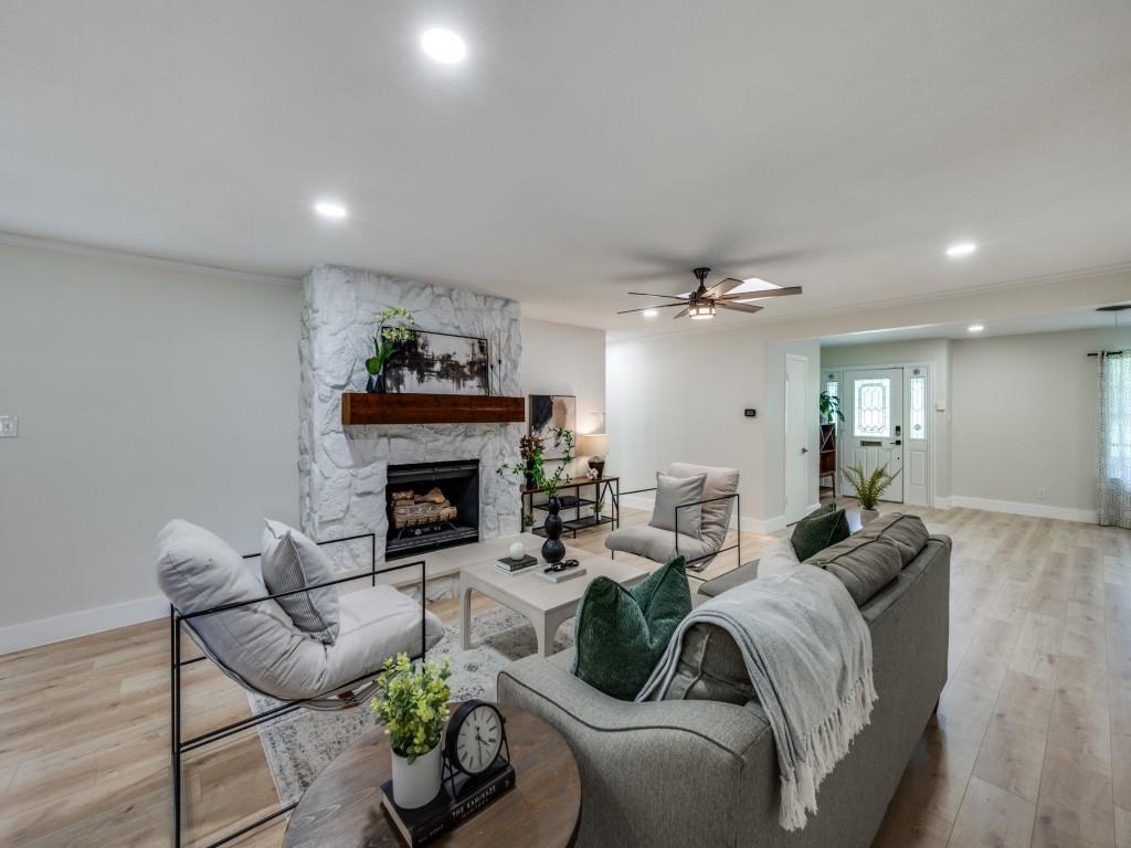 3406 Springwood Lane Dallas, TX 75233 - Photo 8 of 36 a living room with furniture and a fireplace