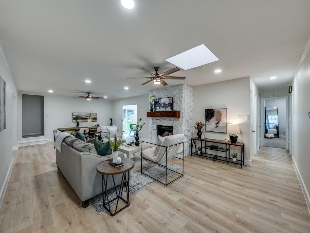 3406 Springwood Lane Dallas, TX 75233 - Photo 9 of 36 a living room with furniture and a wooden floor