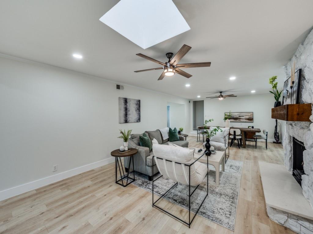 3406 Springwood Lane Dallas, TX 75233 - Photo 10 of 36 a living room with furniture and a wooden floor