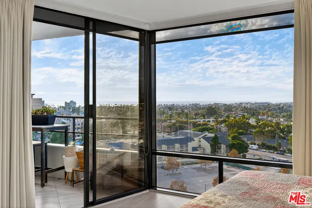 a view of a room with a large window