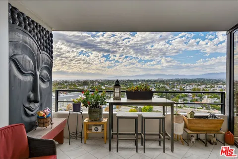 a view of a chairs and table in a terrace