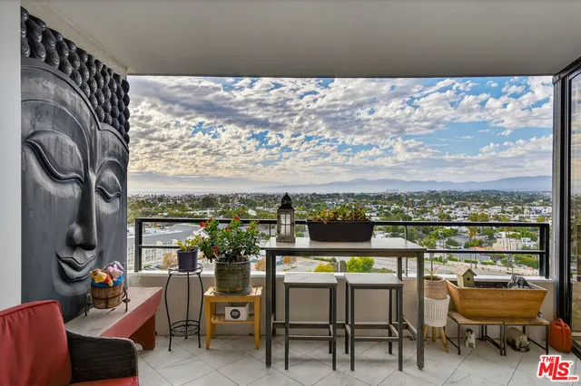 a view of a chairs and table in a terrace