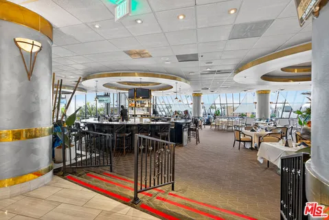 a view of a dining hall with many windows