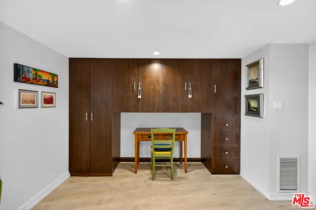 a living room with a couch and a window