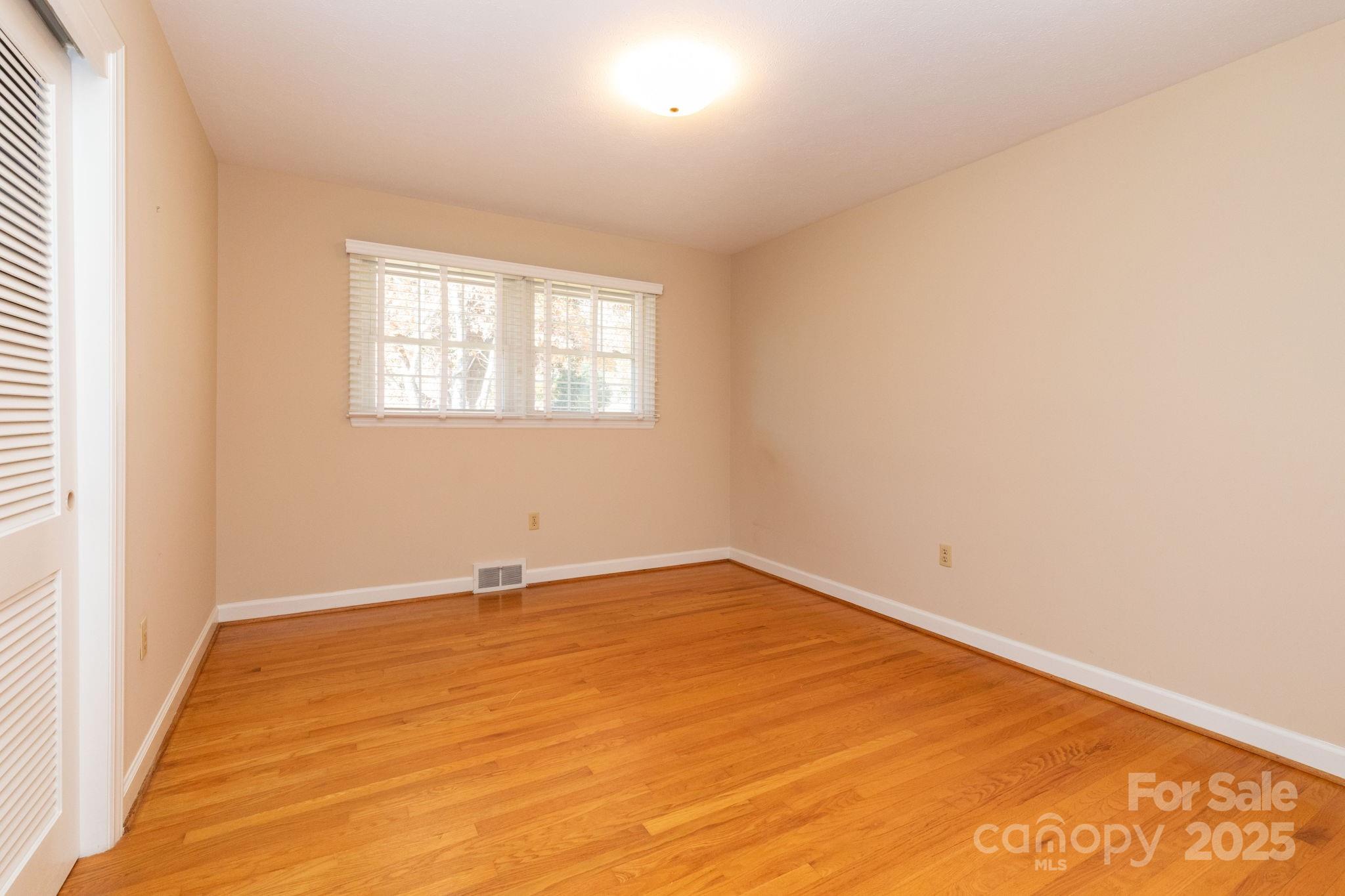 66 Gibson Road Asheville, NC 28804 - Photo 14 of 26 an empty room with a window