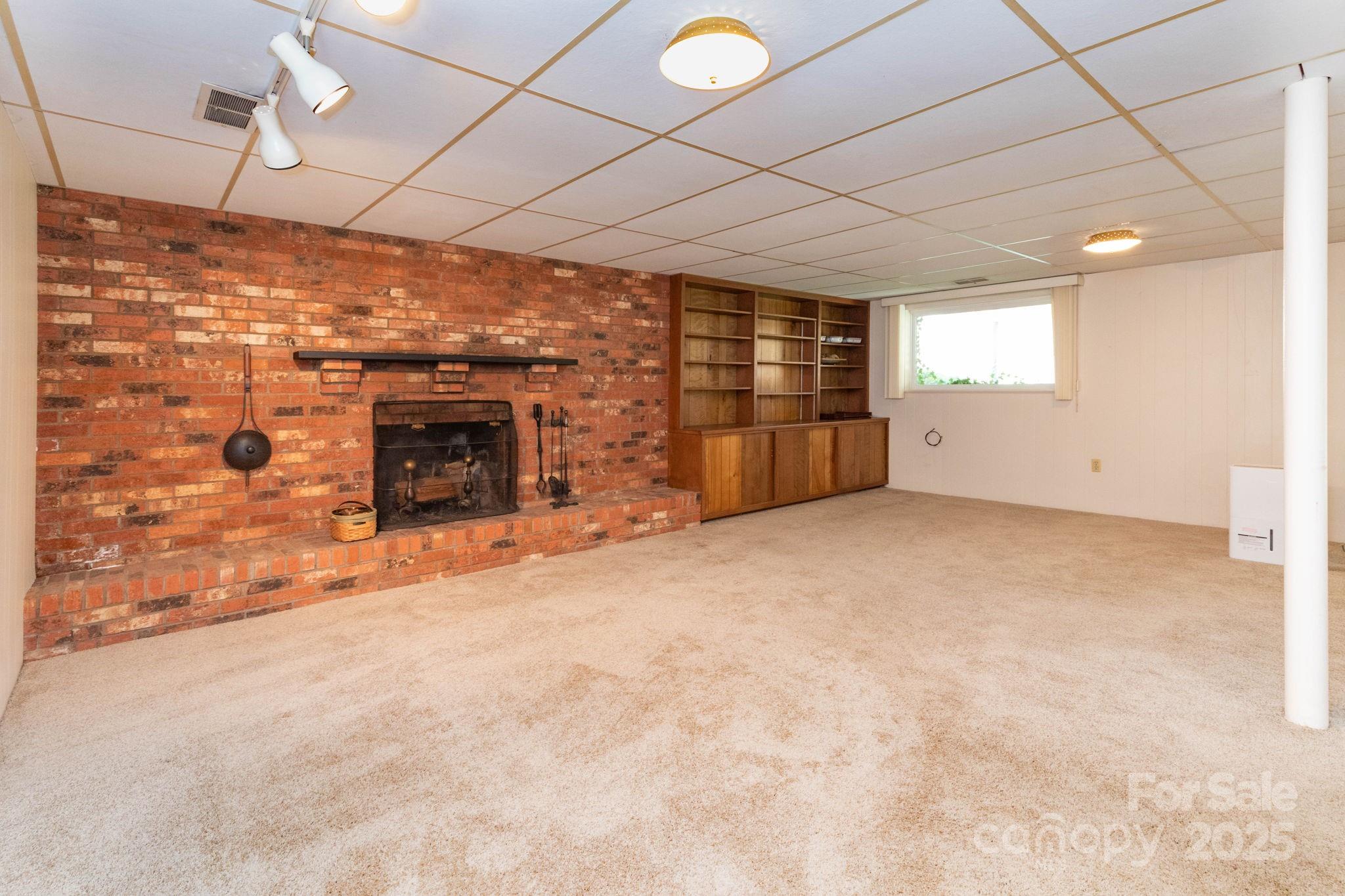 66 Gibson Road Asheville, NC 28804 - Photo 16 of 26 a view of empty room with a fireplace