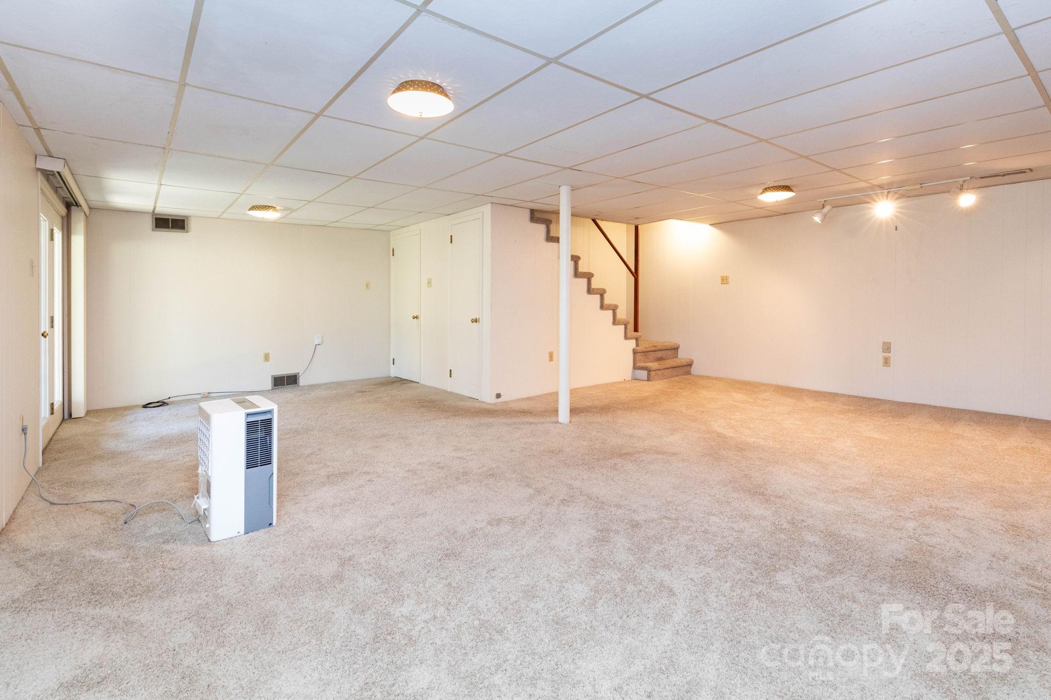 66 Gibson Road Asheville, NC 28804 - Photo 17 of 26 en empty room with windows