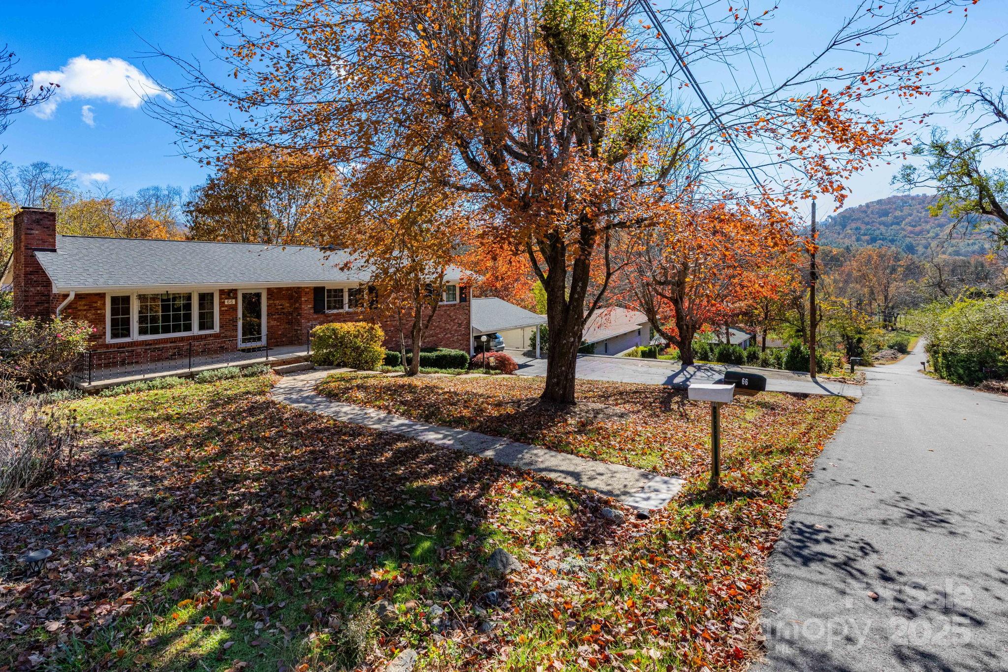 66 Gibson Road Asheville, NC 28804 - Photo 25 of 26 a view of a house with large trees and a yard