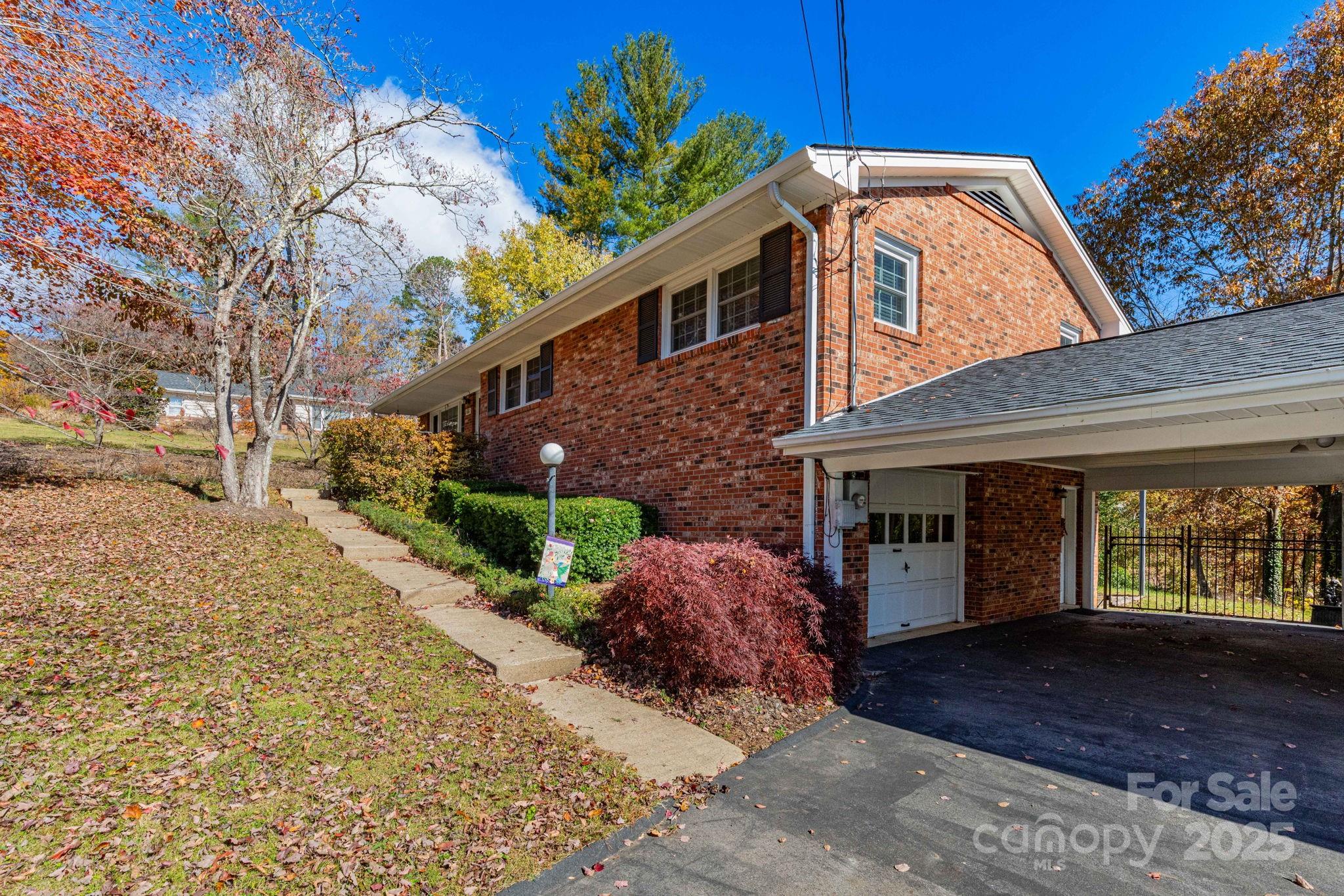 66 Gibson Road Asheville, NC 28804 - Photo 26 of 26 a front view of a house with a yard