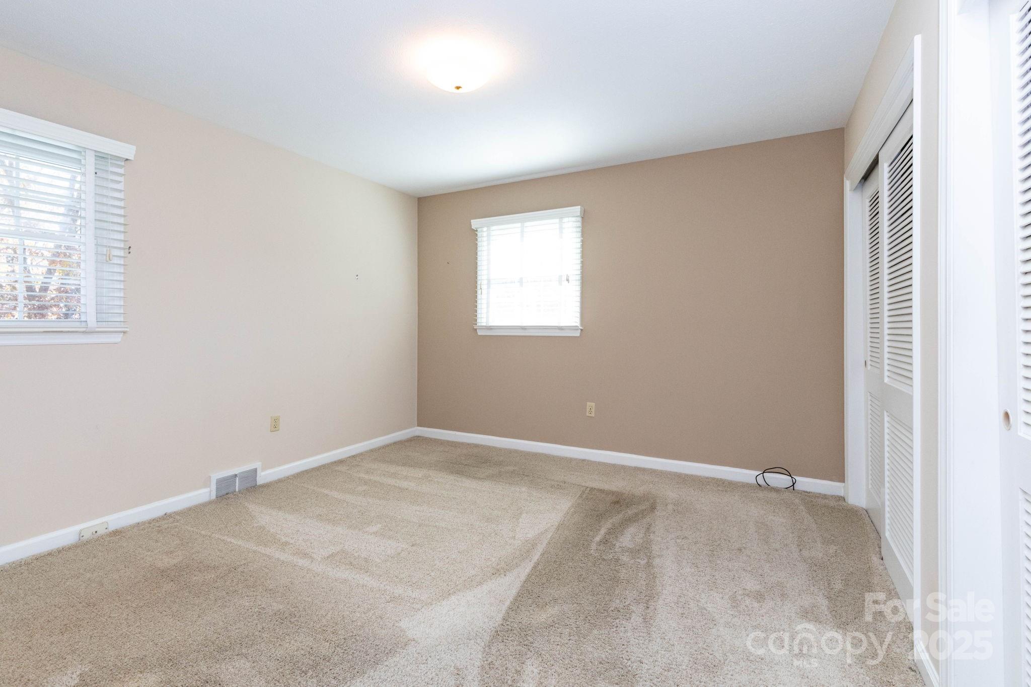 66 Gibson Road Asheville, NC 28804 - Photo 9 of 26 an empty room with windows