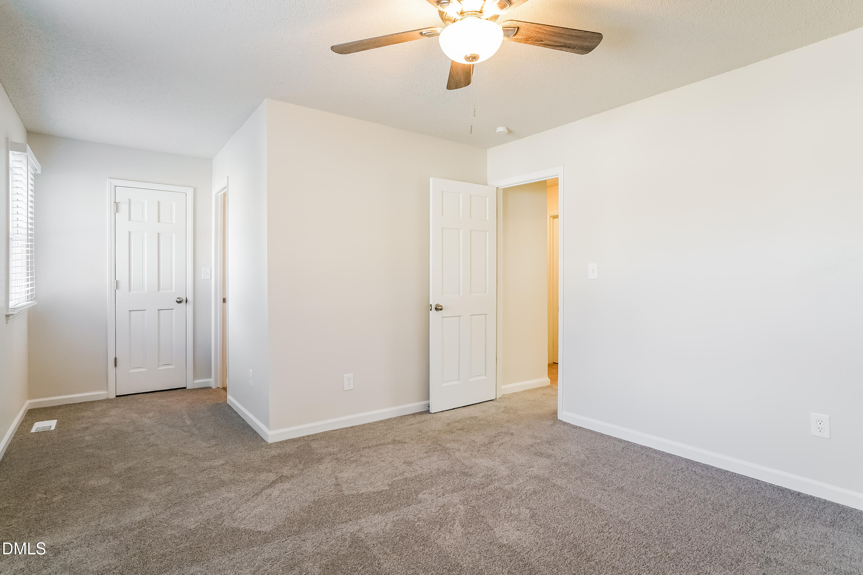 849 Rawls Drive Raleigh, NC 27610 - Photo 11 of 18 an empty room with a chandelier fan