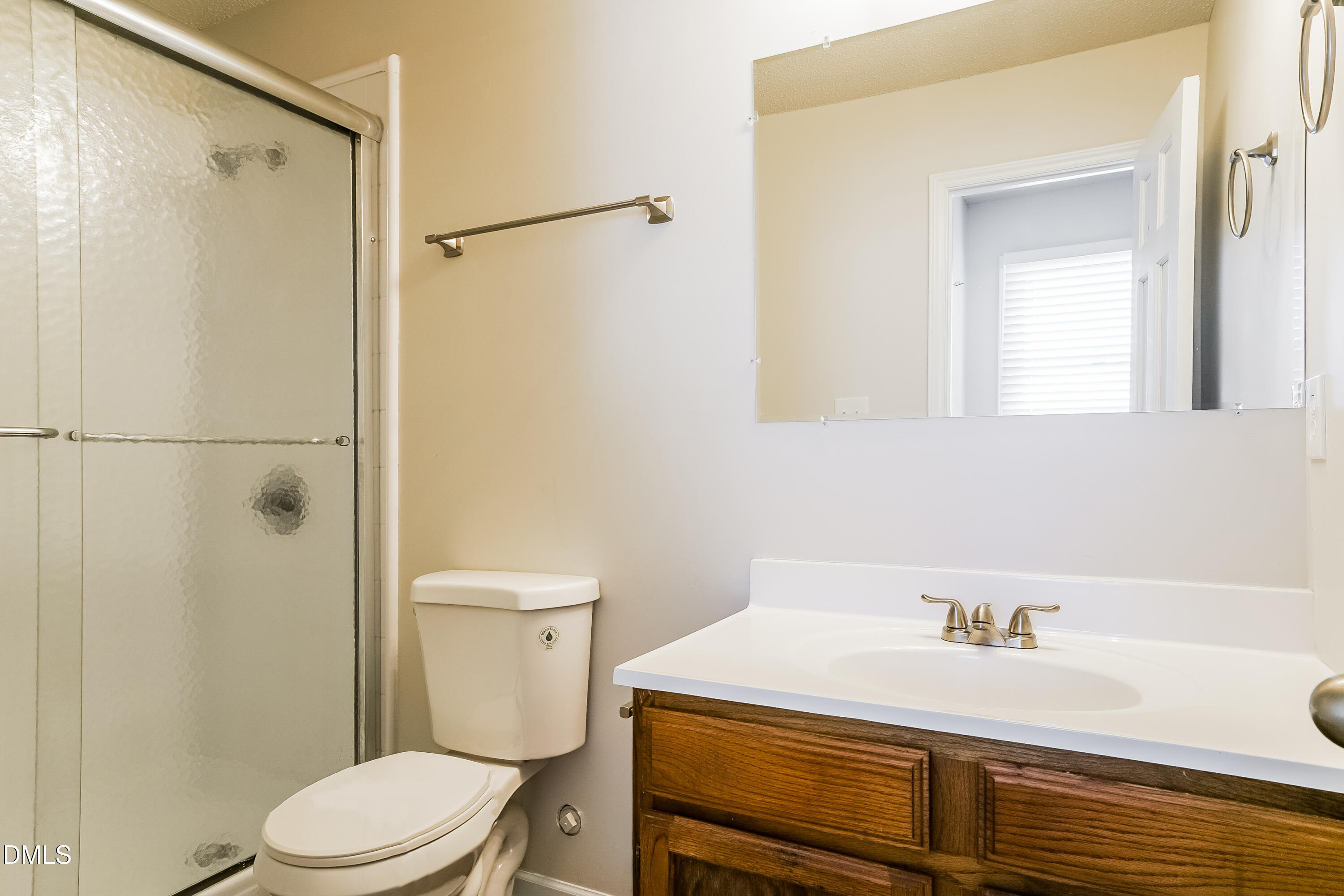 849 Rawls Drive Raleigh, NC 27610 - Photo 12 of 18 a bathroom with a sink a toilet and shower