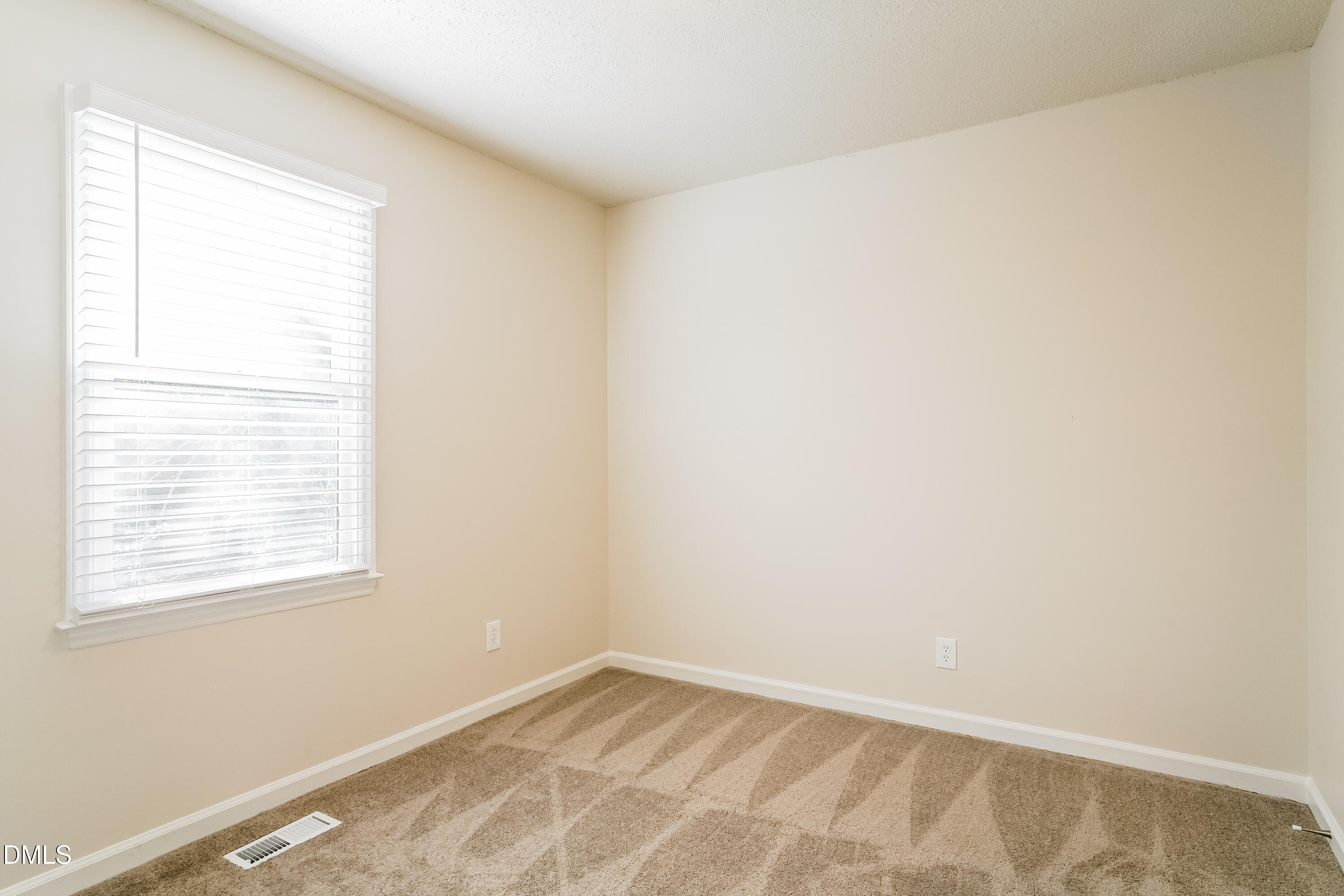 849 Rawls Drive Raleigh, NC 27610 - Photo 13 of 18 an empty room with a window