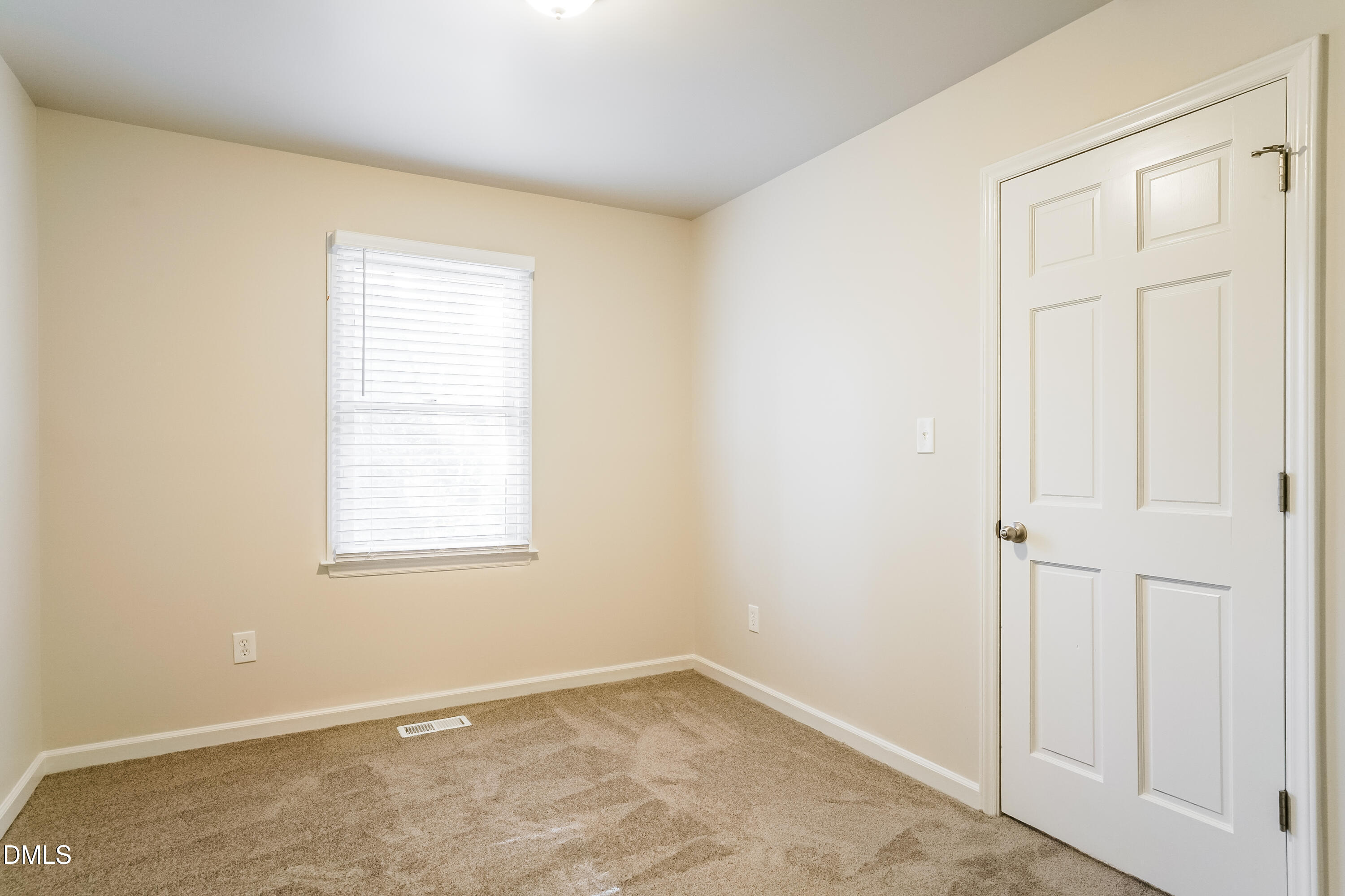 849 Rawls Drive Raleigh, NC 27610 - Photo 14 of 18 an empty room with windows