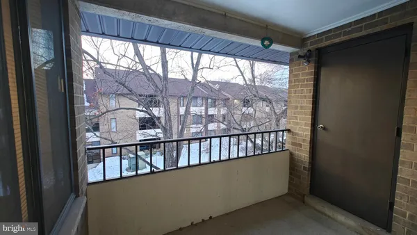 a view of staircase with a porch