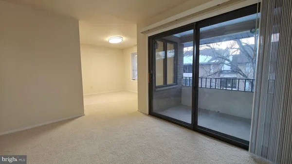a view of a glass door and the balcony