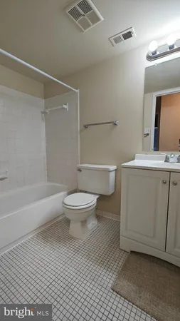 a bathroom with a toilet a sink and a shower