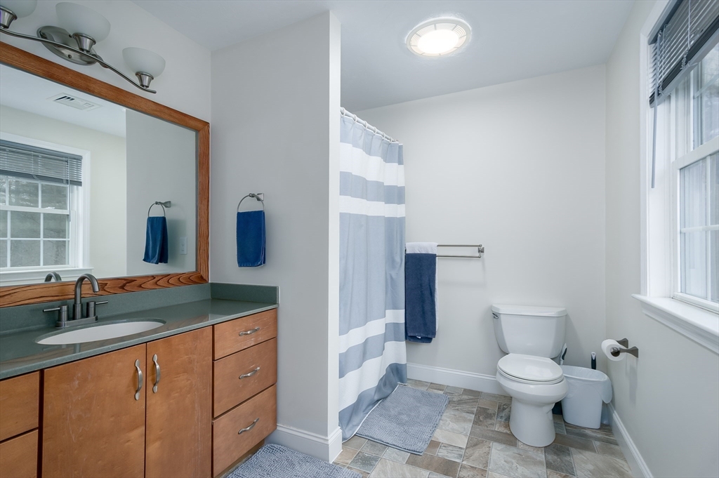 6 Nates Way Rutland, MA 01543 - Photo 19 of 31 a bathroom with a granite countertop toilet sink and mirror