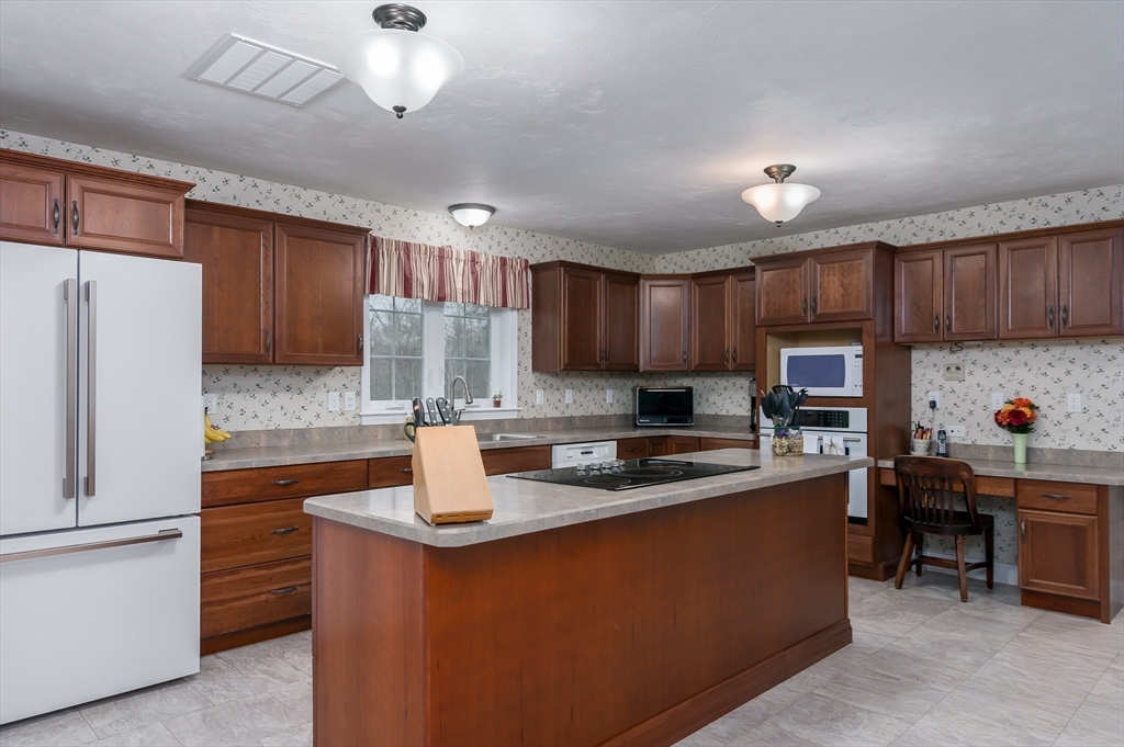 6 Nates Way Rutland, MA 01543 - Photo 2 of 31 a kitchen with stainless steel appliances granite countertop a sink refrigerator and cabinets