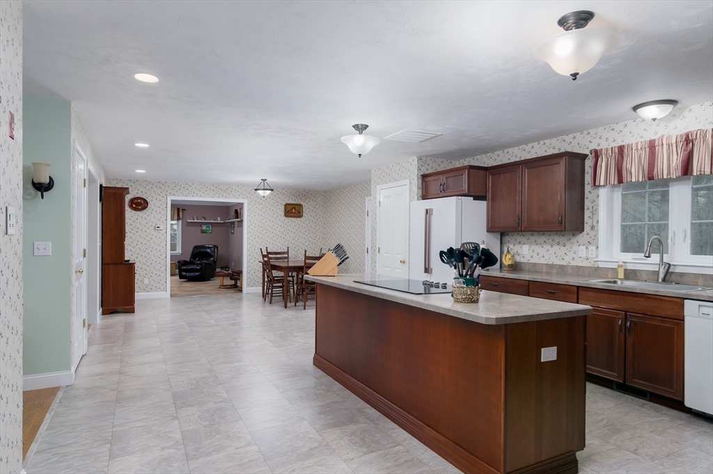 6 Nates Way Rutland, MA 01543 - Photo 6 of 31 a kitchen with stainless steel appliances granite countertop a sink a stove and a refrigerator