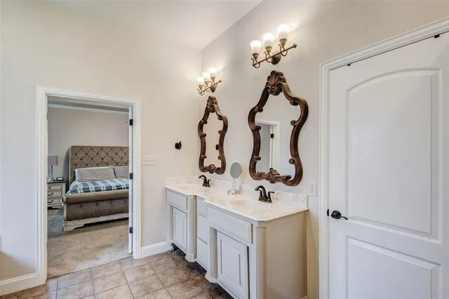 a bathroom with a sink a toilet and mirror