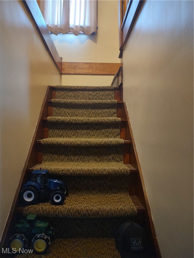 5434 East State Road Newcomerstown, OH 43832 - Photo 20 of 34 View of stairs to upper level..