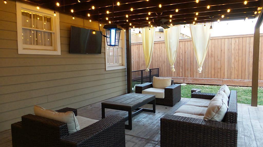 Enjoy outdoor entertaining? You'll love this covered patio with fabulous custom lighting, flat screen tv & outdoor furniture for your enjoyment! Side yard is perfect for doggie-play area that includes gate enclosure.